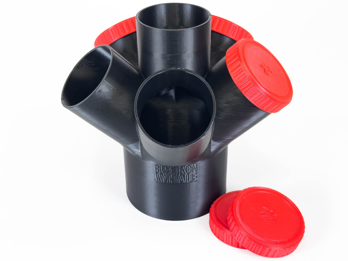 Black Dust Medusa 6-way dust collection splitter standing upright with red caps on several branches.
