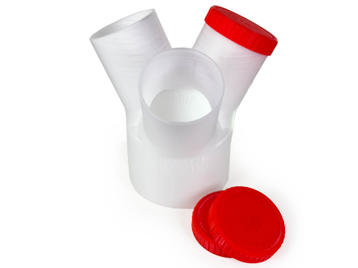 Translucent Dust Medusa 3-way dust collection splitter standing upright, showing its branch openings and caps.
