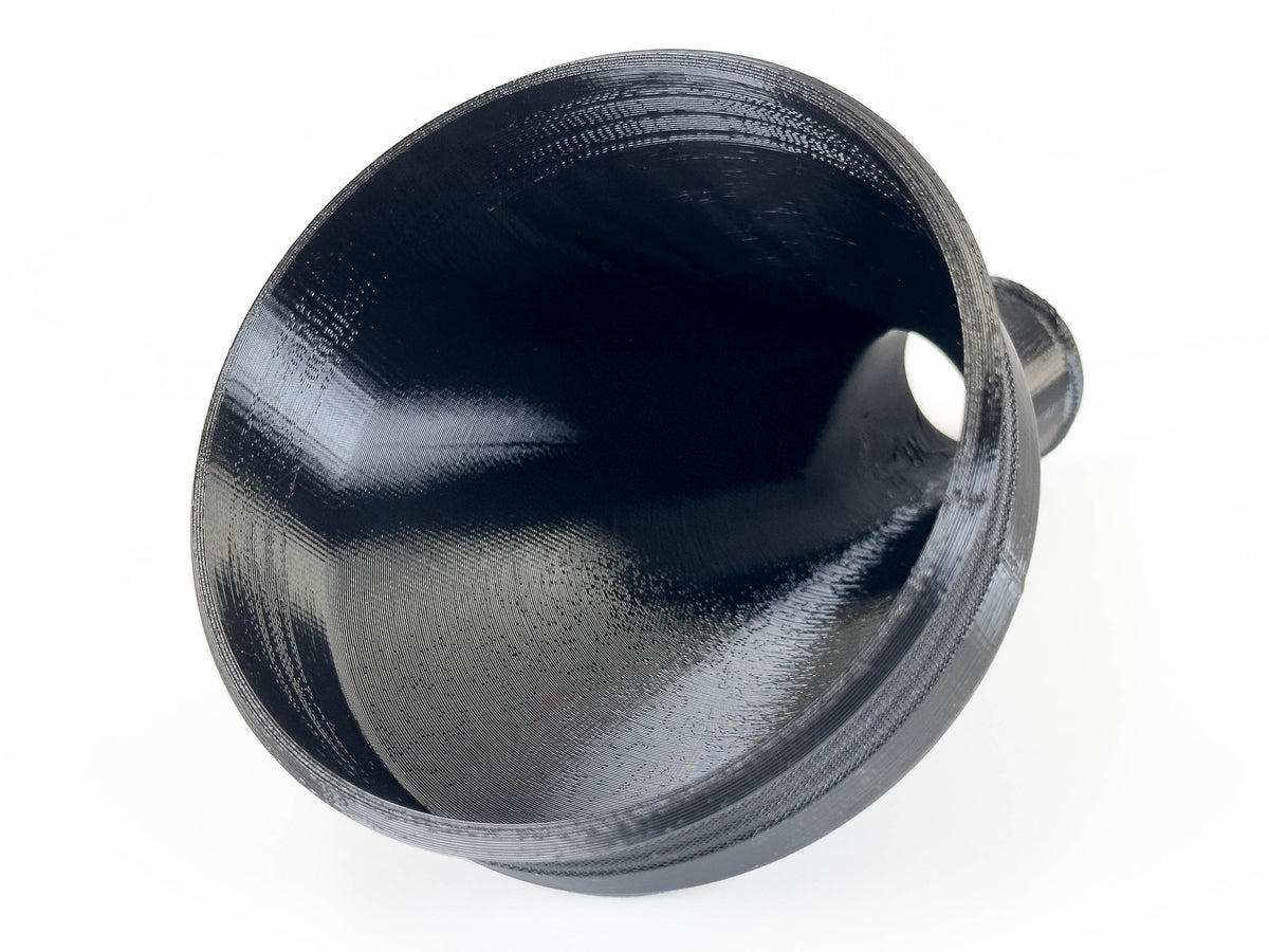 Black 45-degree dust collection reducer, nominal 4 to 1-1/4 inches; view inside the large opening.