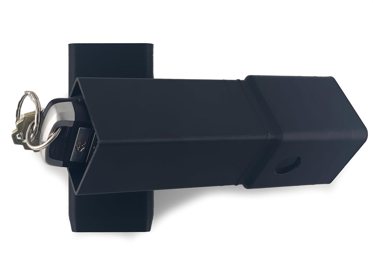 Keys placed in the open Original Regular Hidey-Hitch compartment.