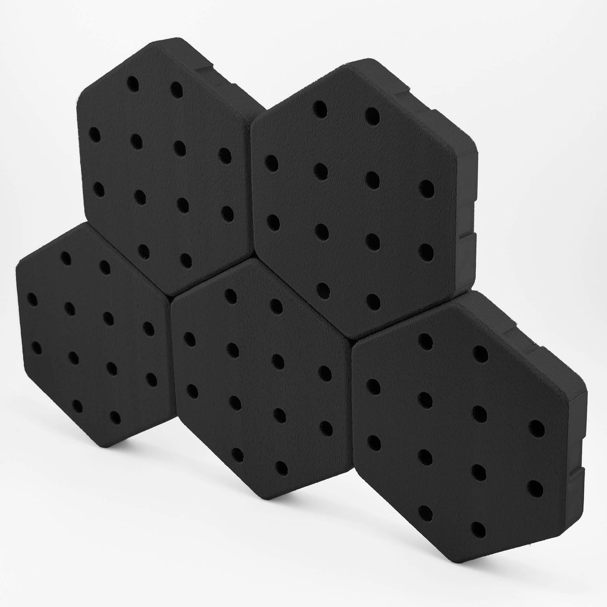 Five connected Hexboard hexagon pegboard tiles in Deep Black.