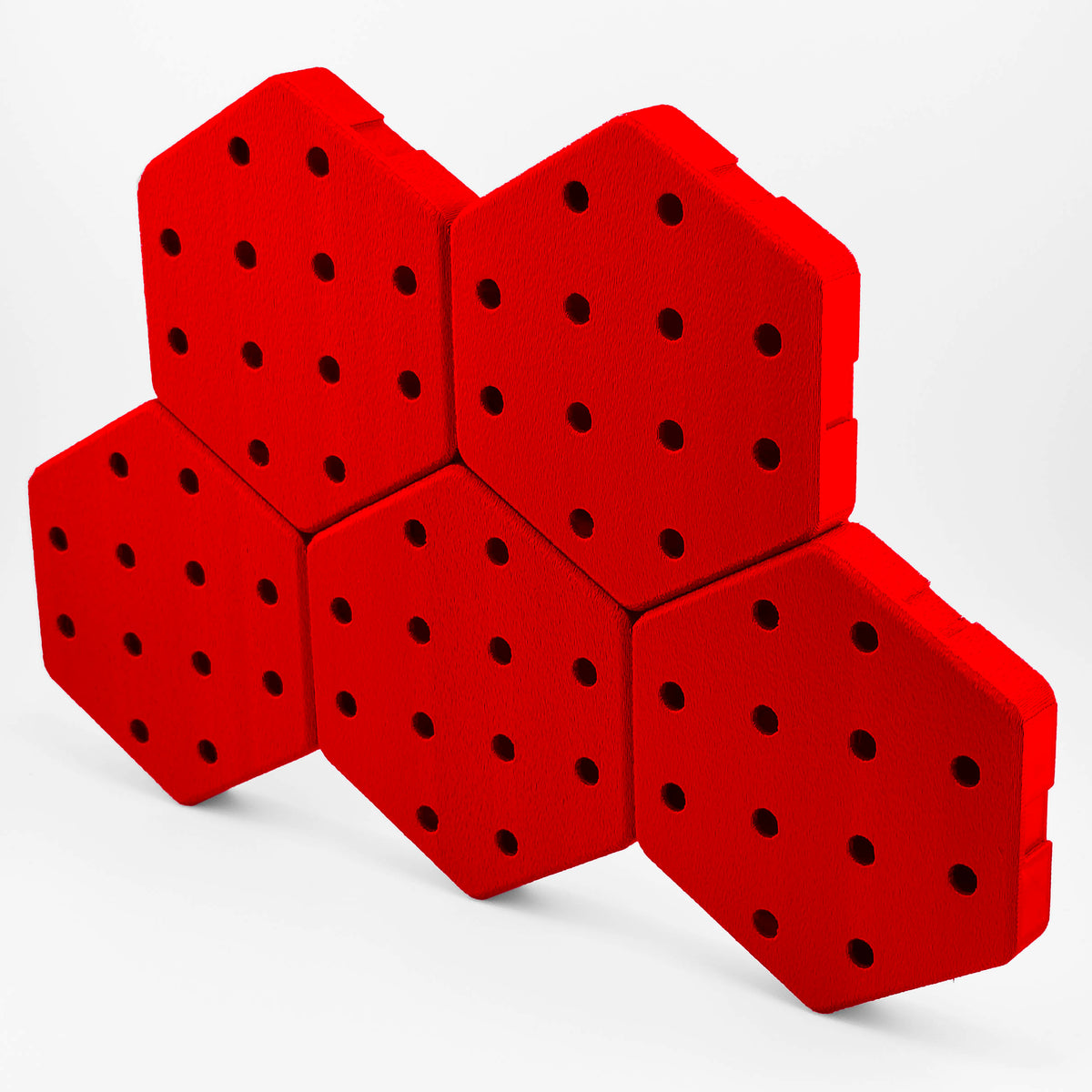 Five connected Hexboard hexagon pegboard tiles in Flame Flash Red.