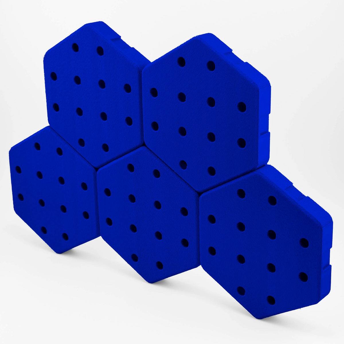 Five connected Hexboard hexagon pegboard tiles in True Blue.