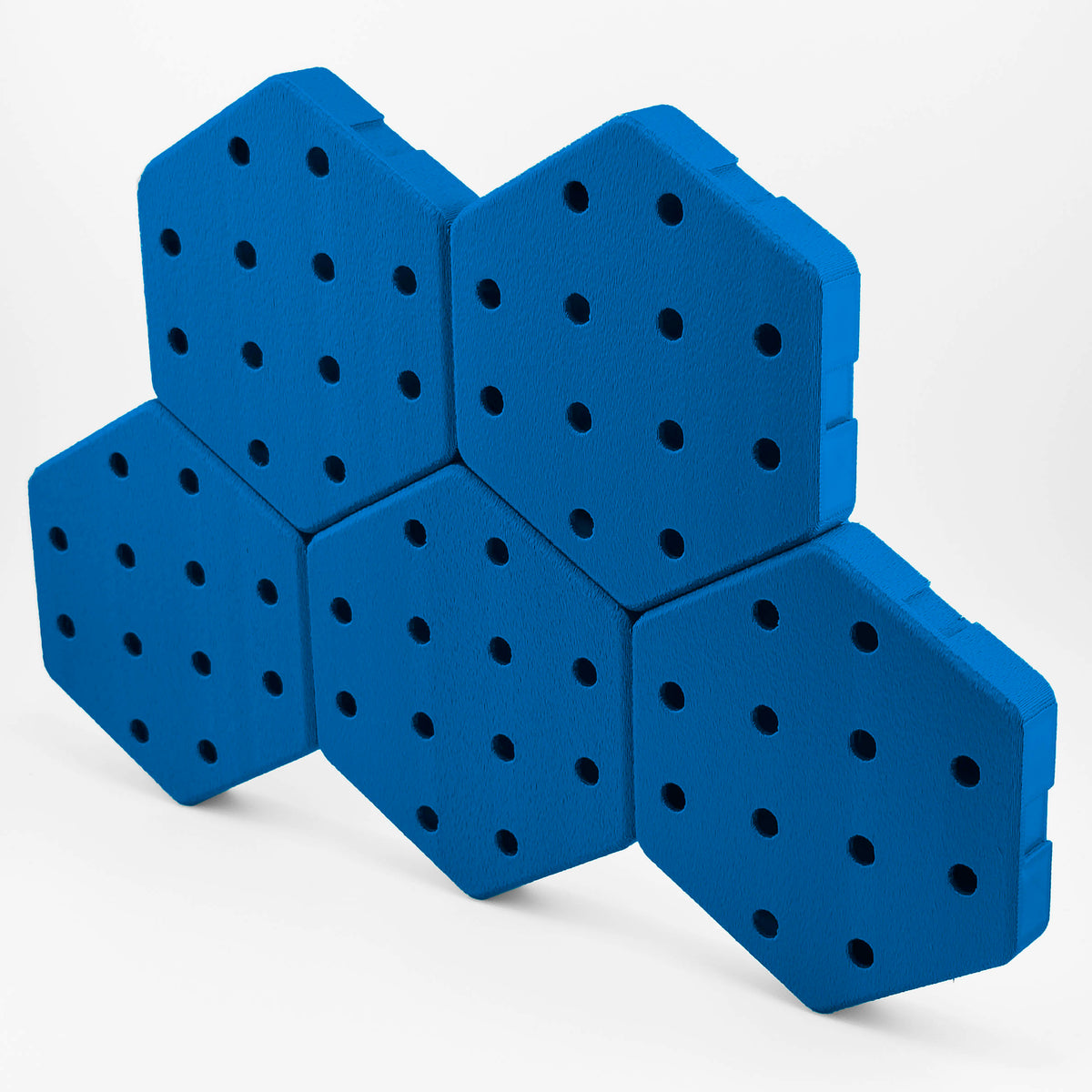 Five connected Hexboard hexagon pegboard tiles in Electric Blue.