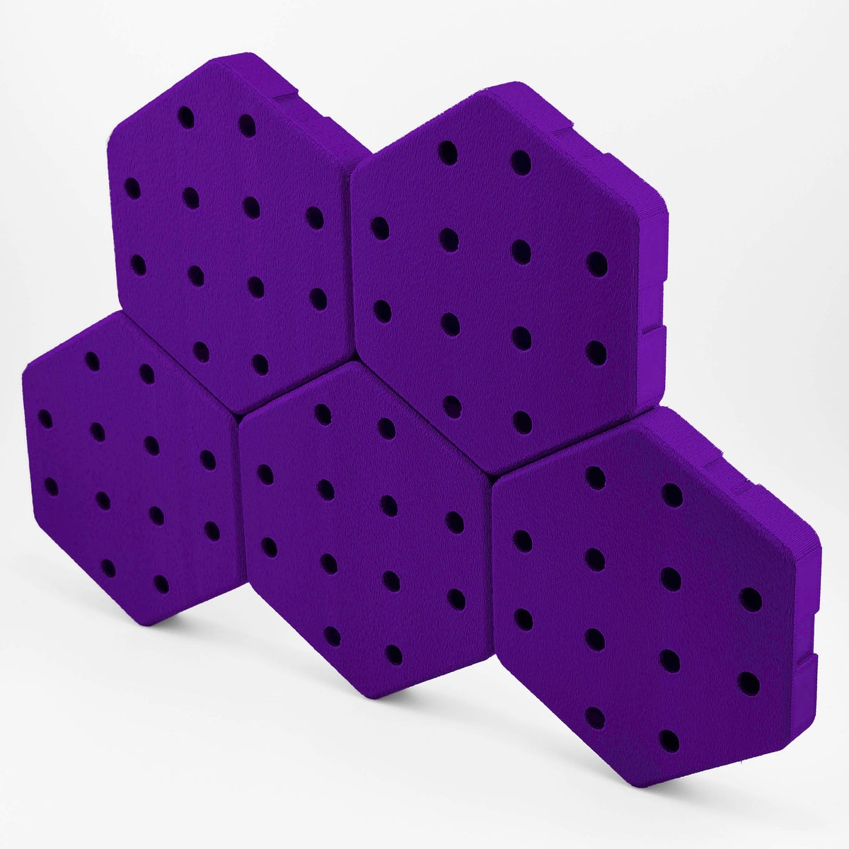 Five connected Hexboard hexagon pegboard tiles in Velvet Purple.